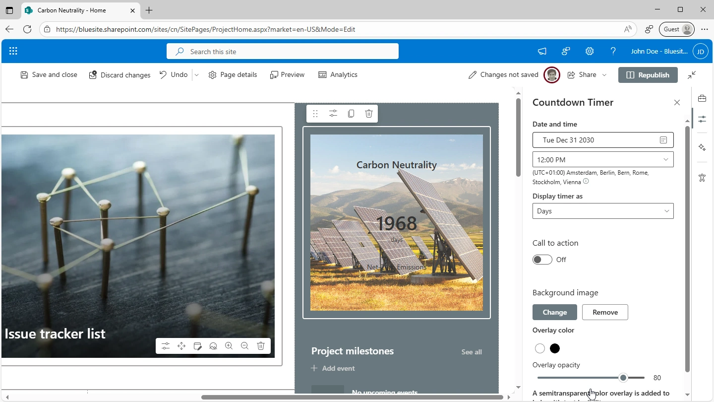 sharepoint homepage in edit mode, in the middle is the countdown timer web part showing 1968 days until net-zero emissions in front of a background image of a dozens of solar panels on a gras field in front of mountains, right hand the properties of the web part are listed: date and time, display timer as days, call to action is set off and the overlay opacity is set to 80